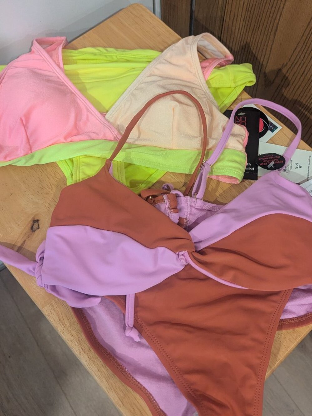 New with Tags-One swim top is missing it's tags and may have been worn once. Oth